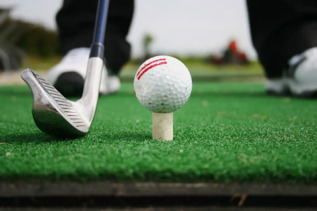 Golfer preparing to hit a golf ball